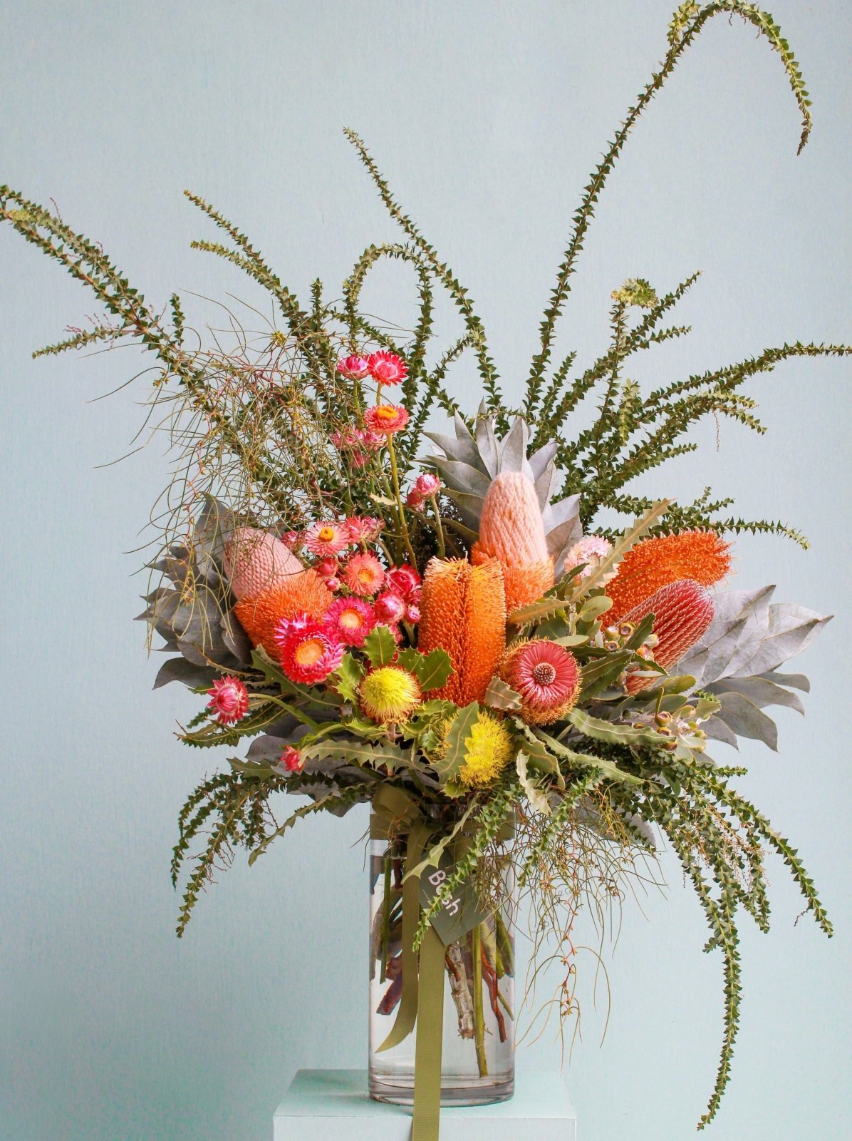 Extra large size bouquet of native flowers in a glass vase