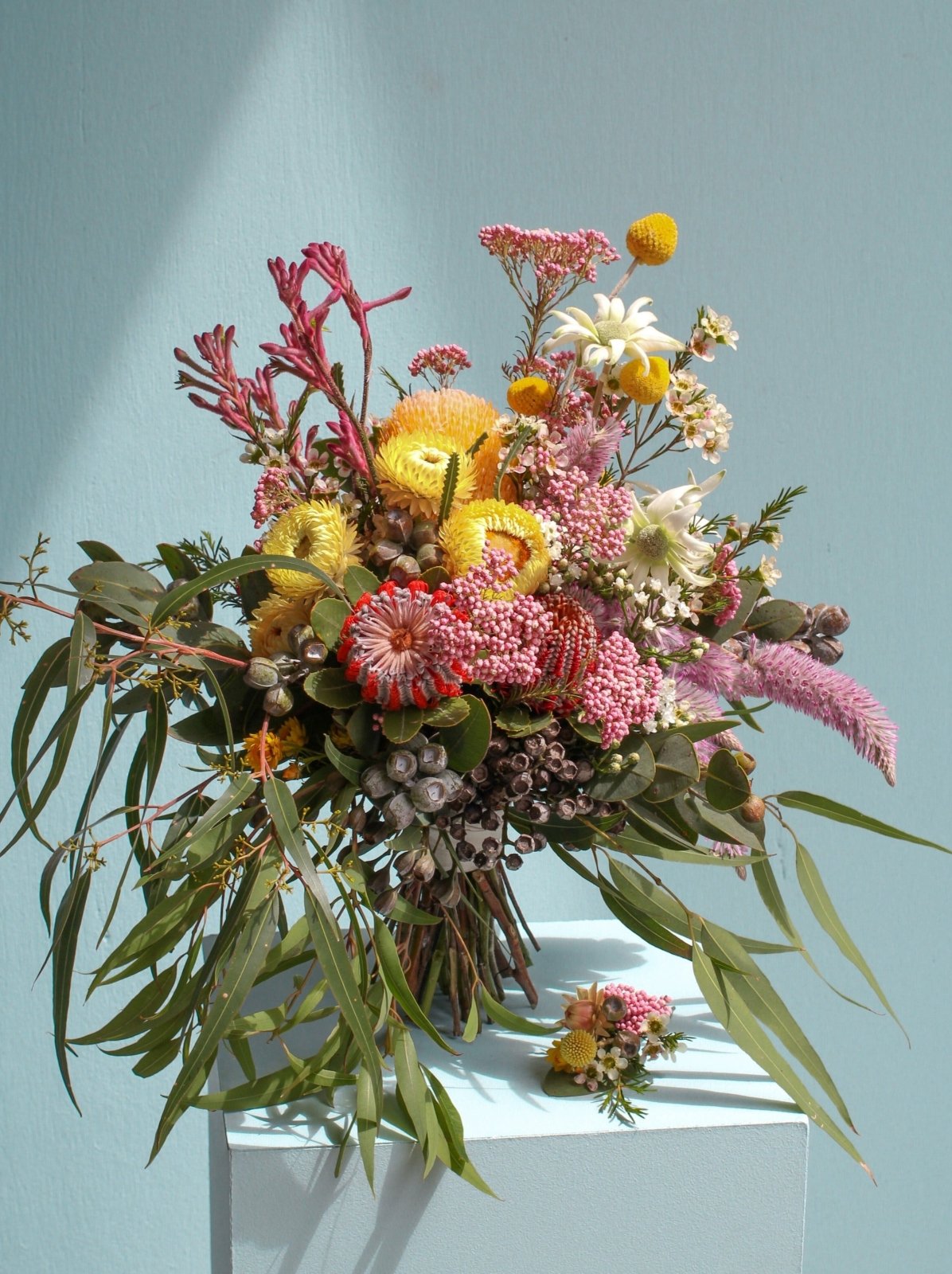 Australian Native Wedding Bridal Bouquet. Featuring Rice flower, Strawflower, Flannel, Geraldton Wax, Eucalyptus, Banksia Coccinea, Kangaroo Paw and Billy Buttons.