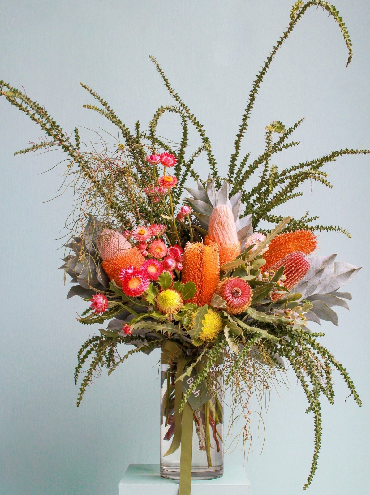 Extra large size bouquet of native flowers in a glass vase